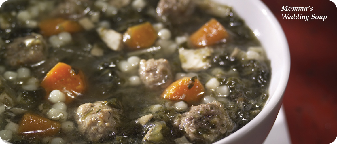 A bowl of wedding soup with meatballs, carrots, spinach, and small pasta in broth. Text reads "Momma's Wedding Soup.