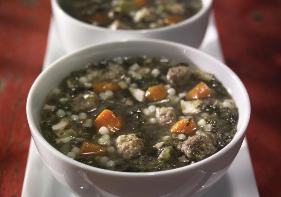 Two bowls of soup on a white plate